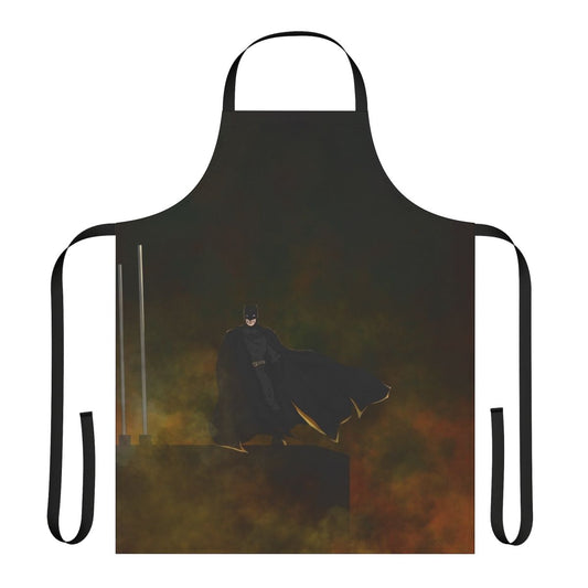 A colorful superhero-themed apron with images of bats and comic book elements