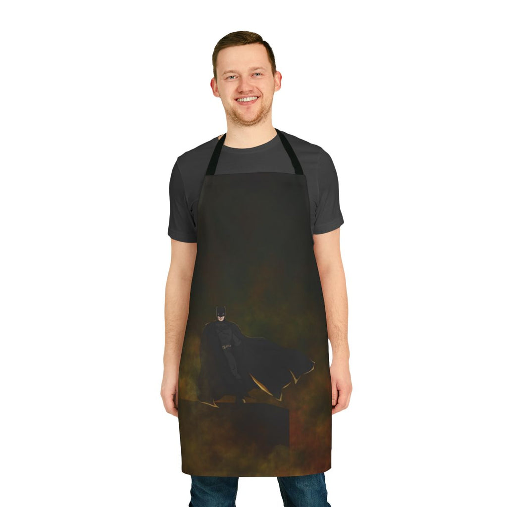 A colorful superhero-themed apron with images of bats and comic book elements