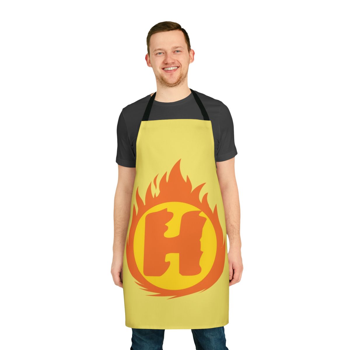 A red and yellow apron featuring a superhero-style letter H fire insignia design.