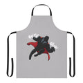 A black and red apron with a superhero-inspired graphic, representing the Y2K era's bold fashion.