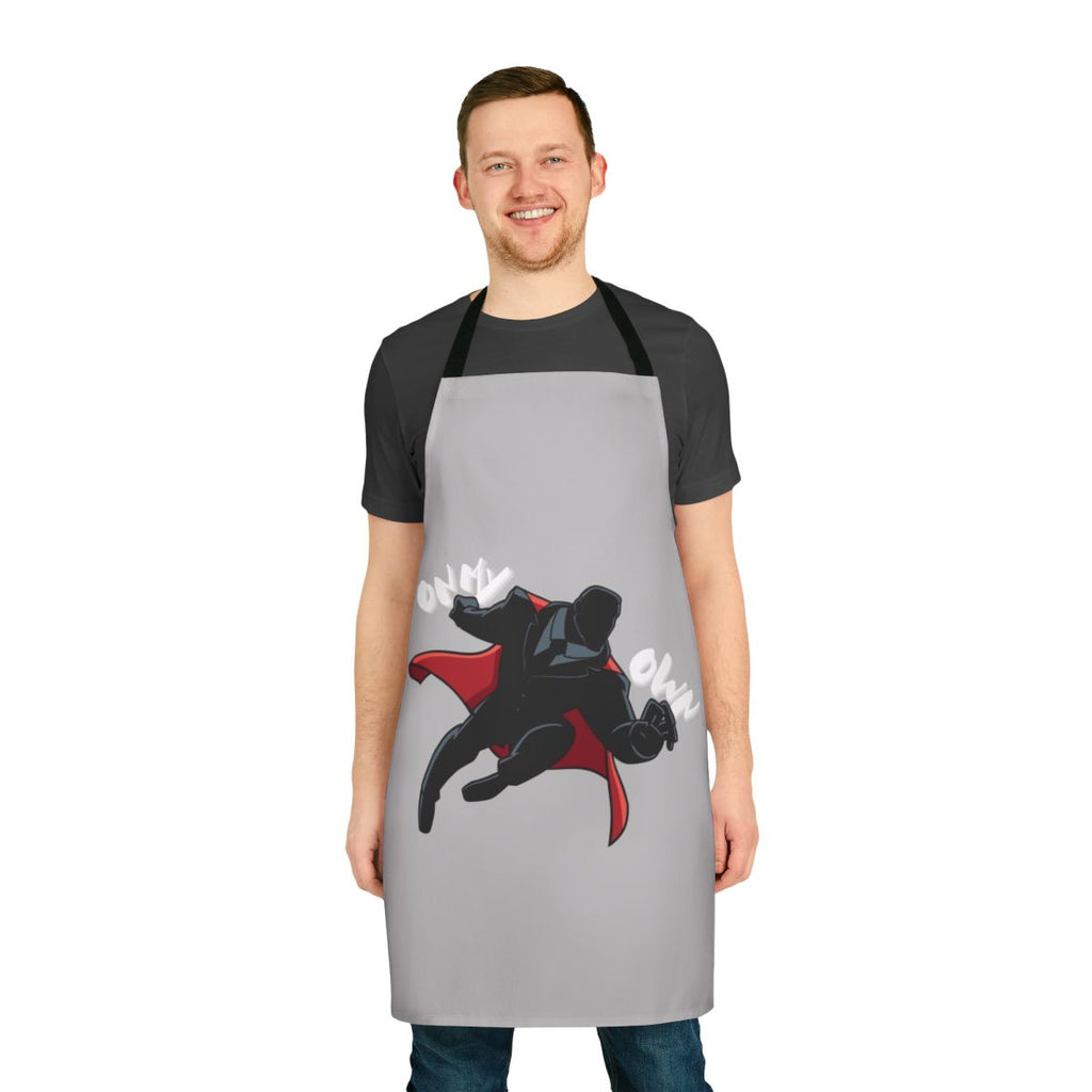 A black and red apron with a superhero-inspired graphic, representing the Y2K era's bold fashion.