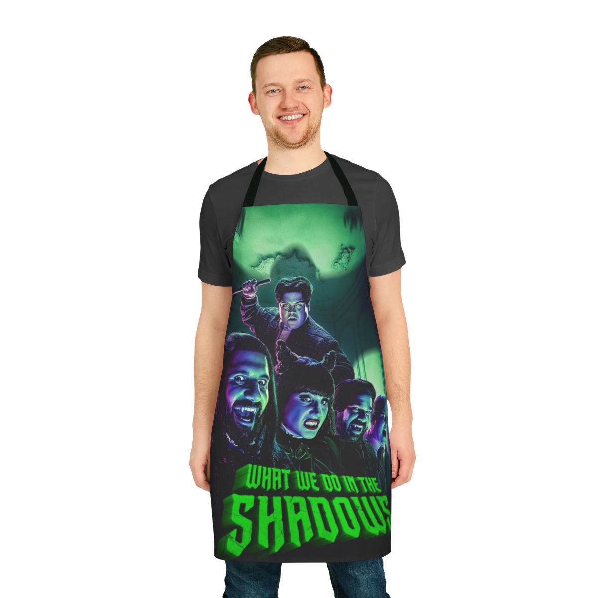 A black apron featuring the characters from the TV show "What We Do in the Shadows"