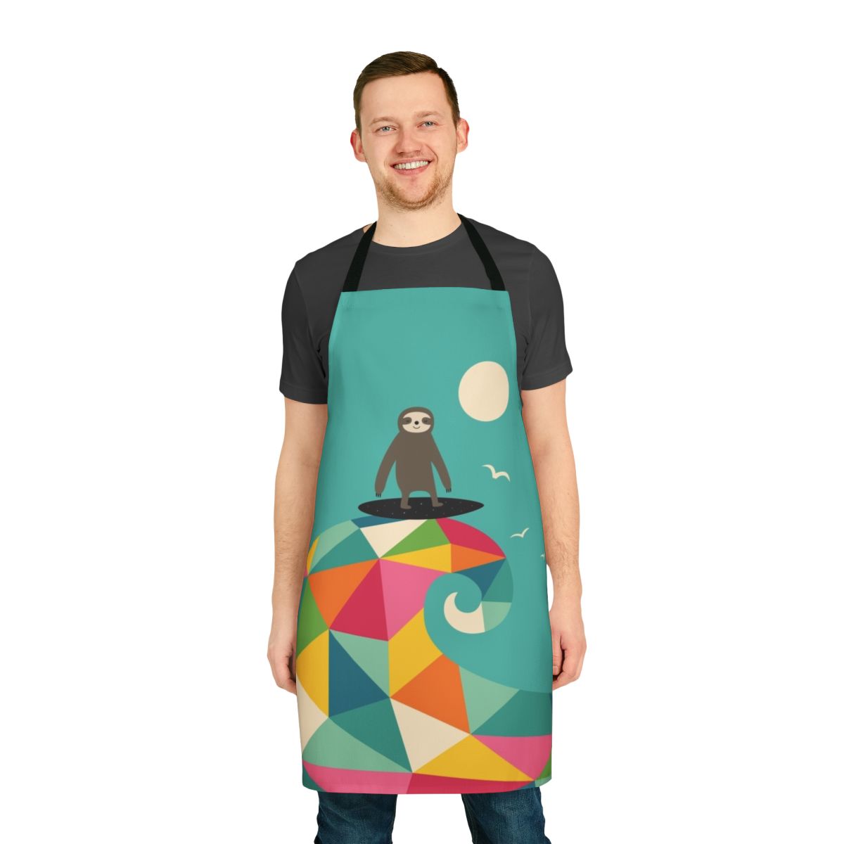 Colorful geometric rainbow pattern with a surfing sloth design on an apron