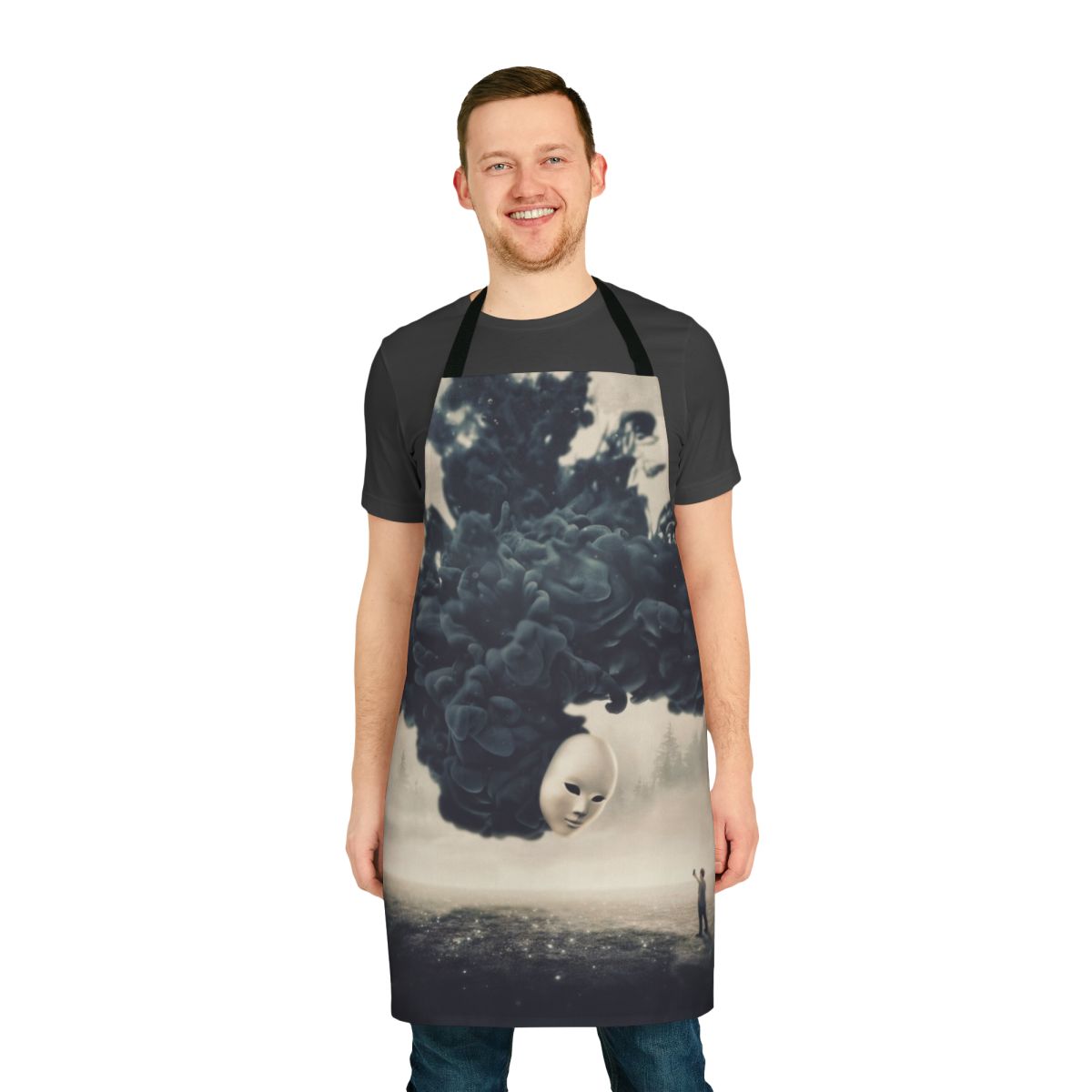 A dark, surreal apron featuring a spooky, dreamlike landscape and a floating cell phone taking a "selfie"