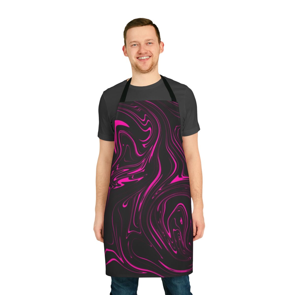 A black and pink apron with a swirling galaxy-inspired fluid art pattern.