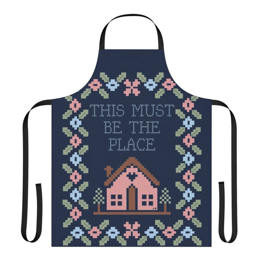 A stylish and high-quality kitchen apron featuring a graphic design inspired by the iconic Talking Heads song "This Must Be the Place".