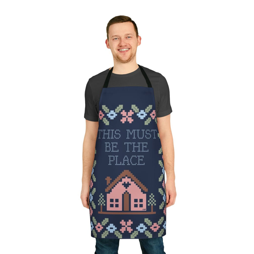 A stylish and high-quality kitchen apron featuring a graphic design inspired by the iconic Talking Heads song "This Must Be the Place".