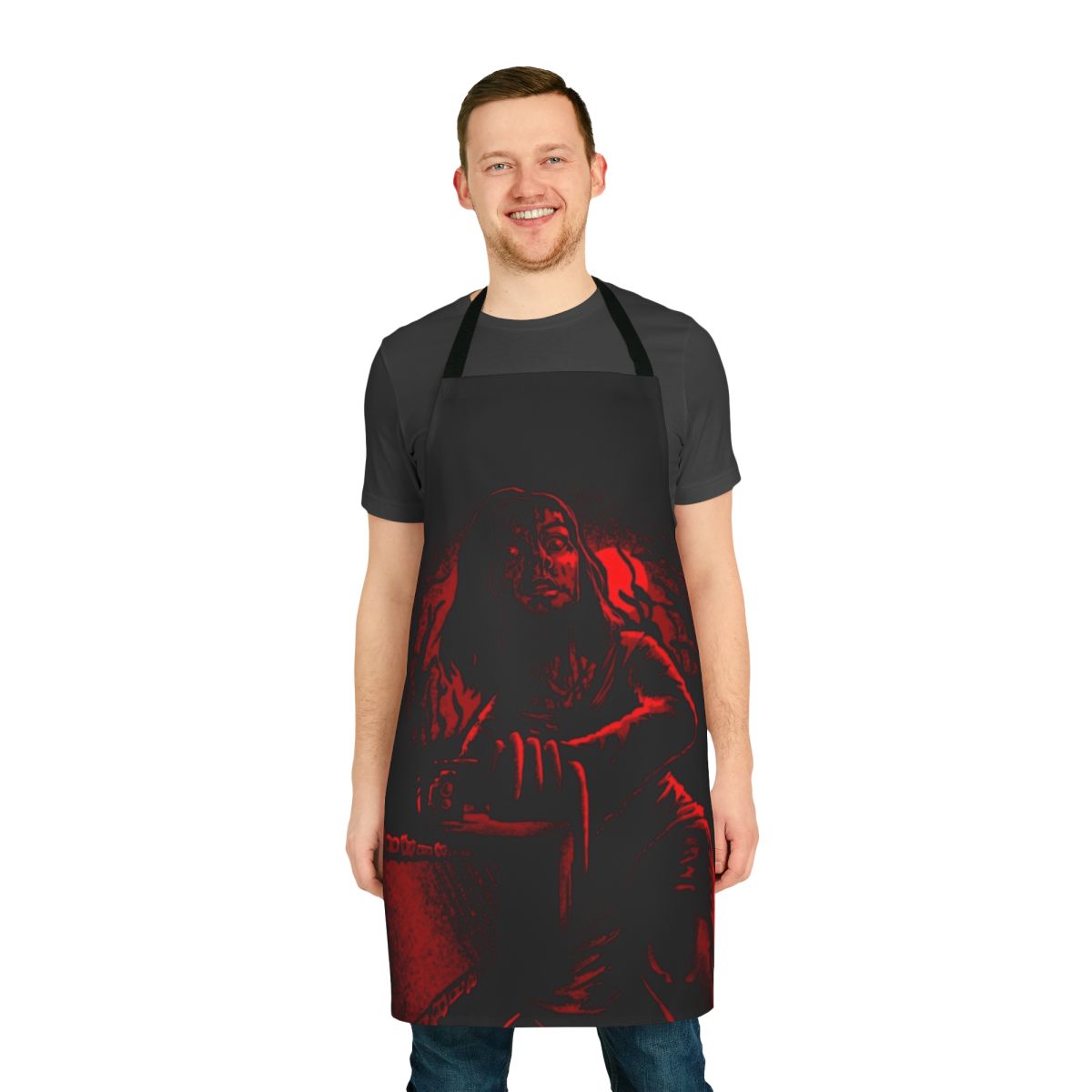 A red and black apron featuring horror movie elements like a chainsaw, blood, and the word "Abomination"