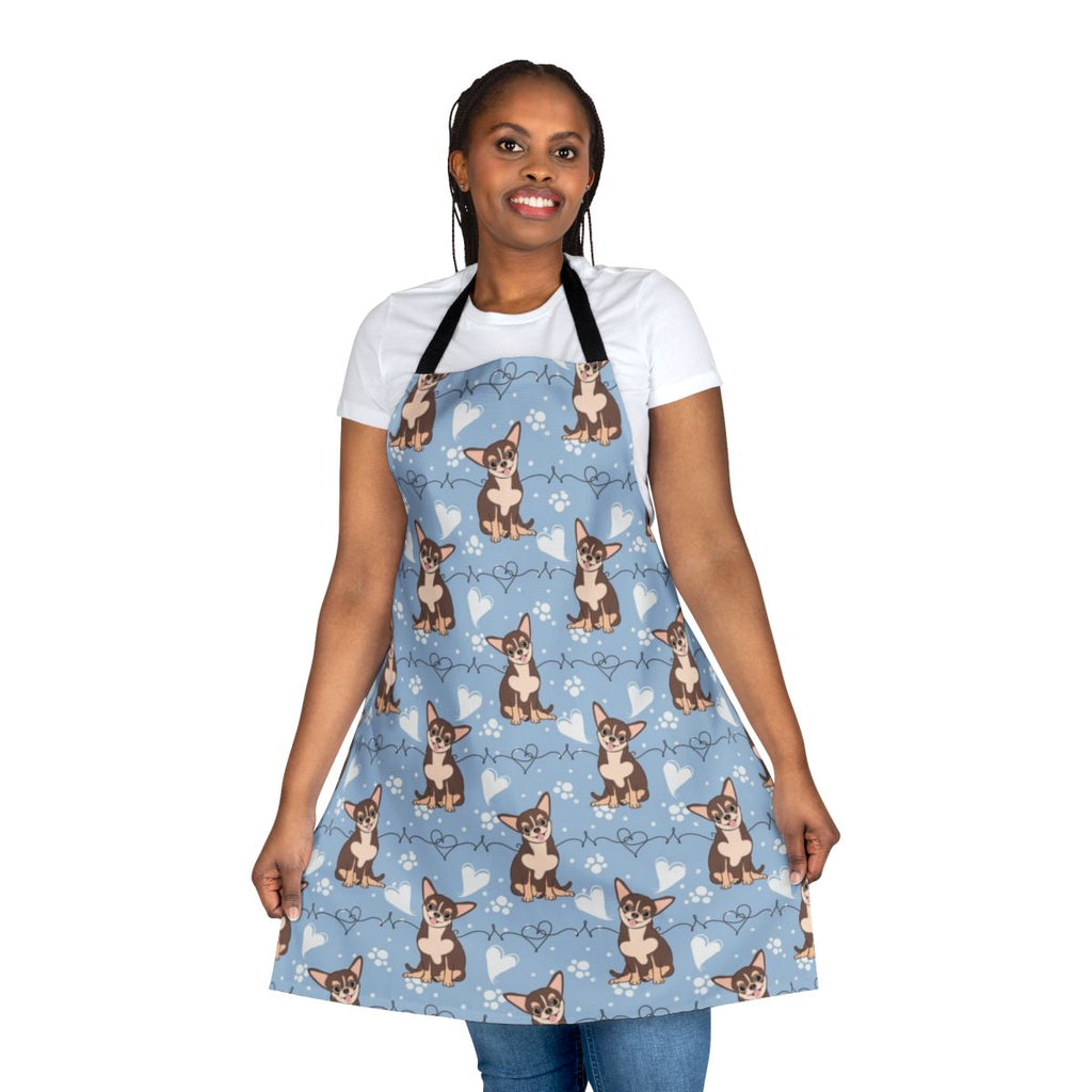 A tri-color chihuahua-themed cooking apron with a cute, cartoon-style print.