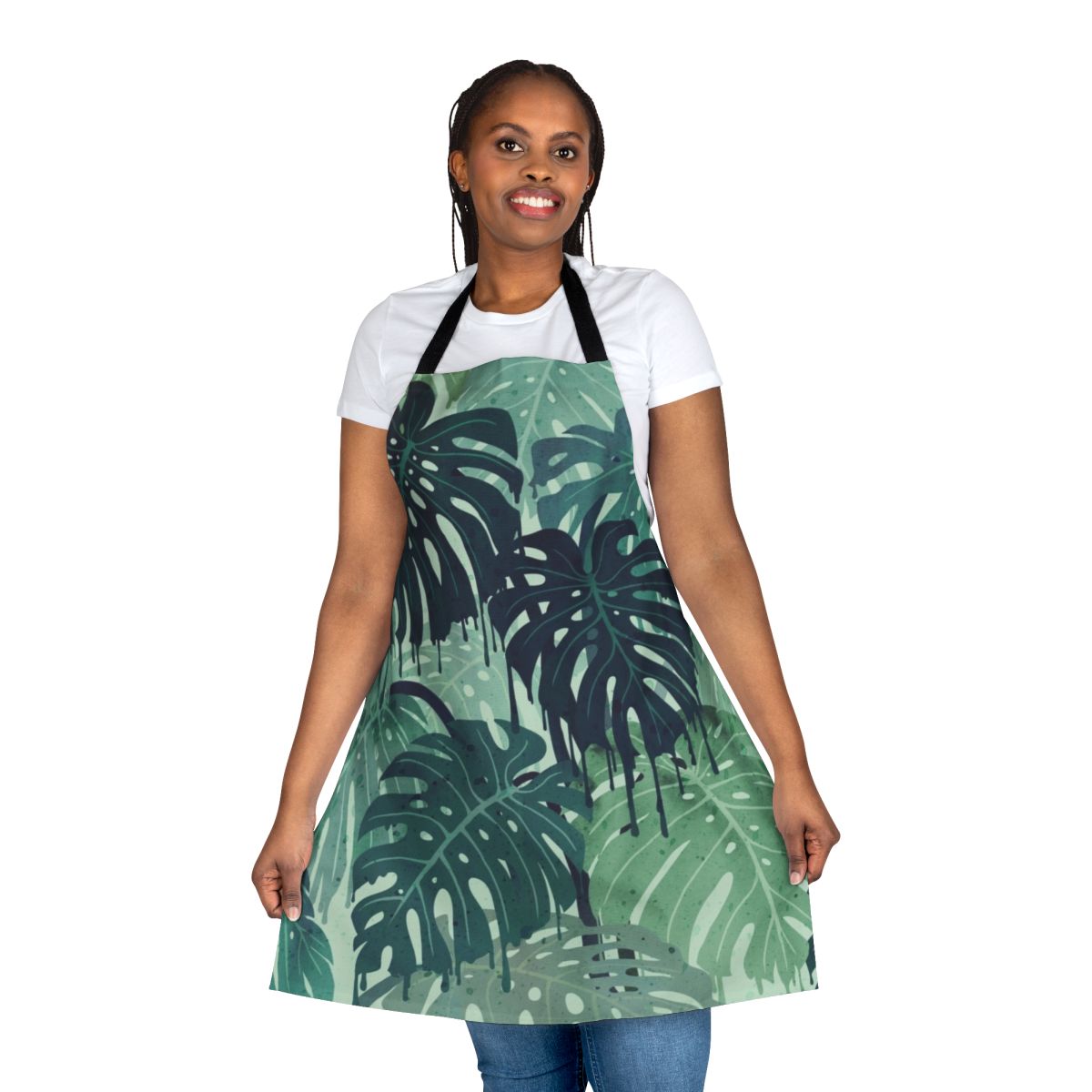 Tropical monstera leaves pattern on a green apron with blue accents