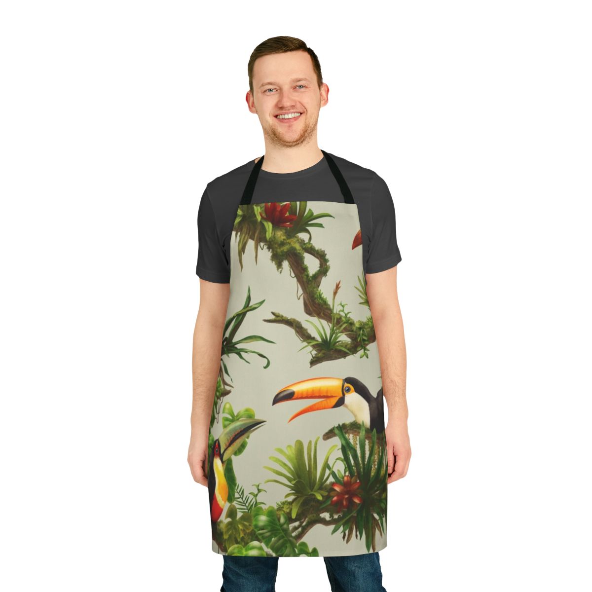 Apron featuring a colorful pattern of toucans and bromeliads against a lush, green background
