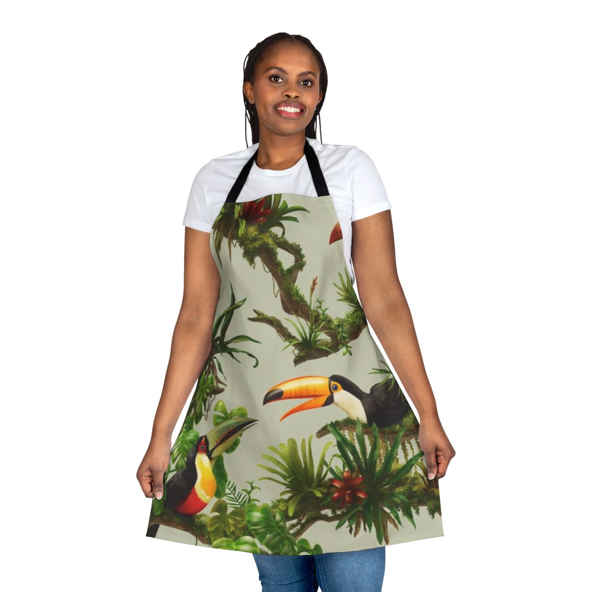 Apron featuring a colorful pattern of toucans and bromeliads against a lush, green background