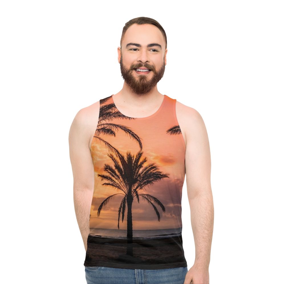 Unisex tank top with a tropical sunrise over palm trees design