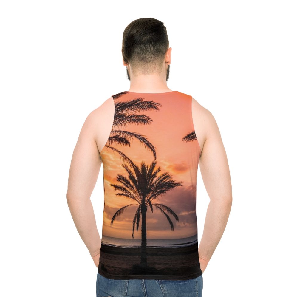 Unisex tank top with a tropical sunrise over palm trees design