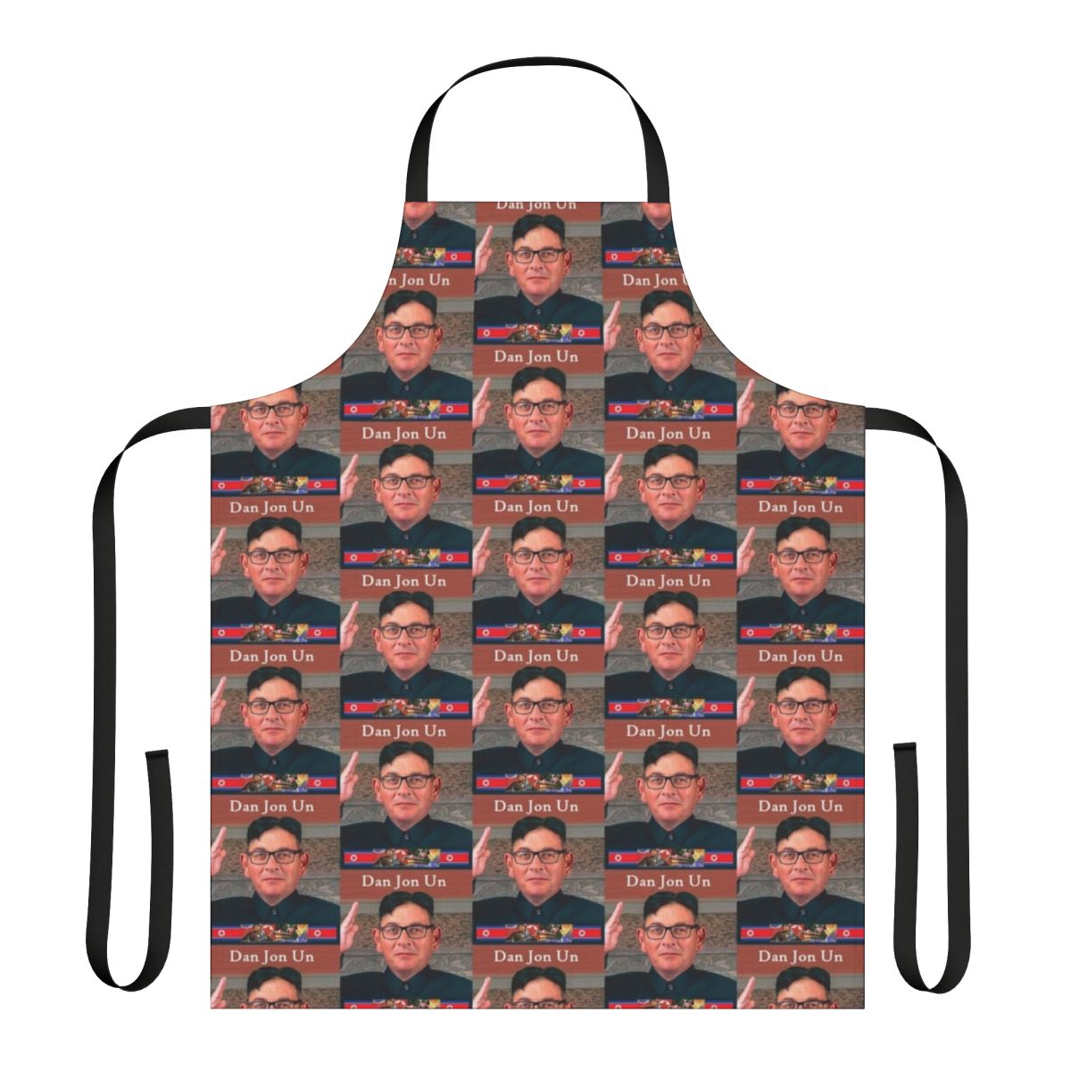 A cooking apron featuring a caricature of a dictator, suitable for making light of authoritarian politics.