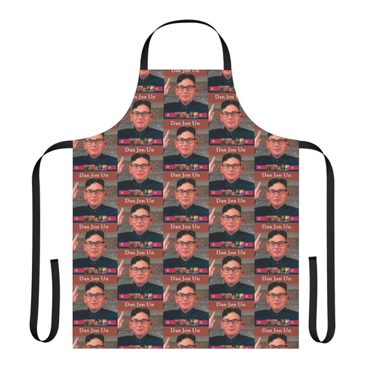 A cooking apron featuring a caricature of a dictator, suitable for making light of authoritarian politics.