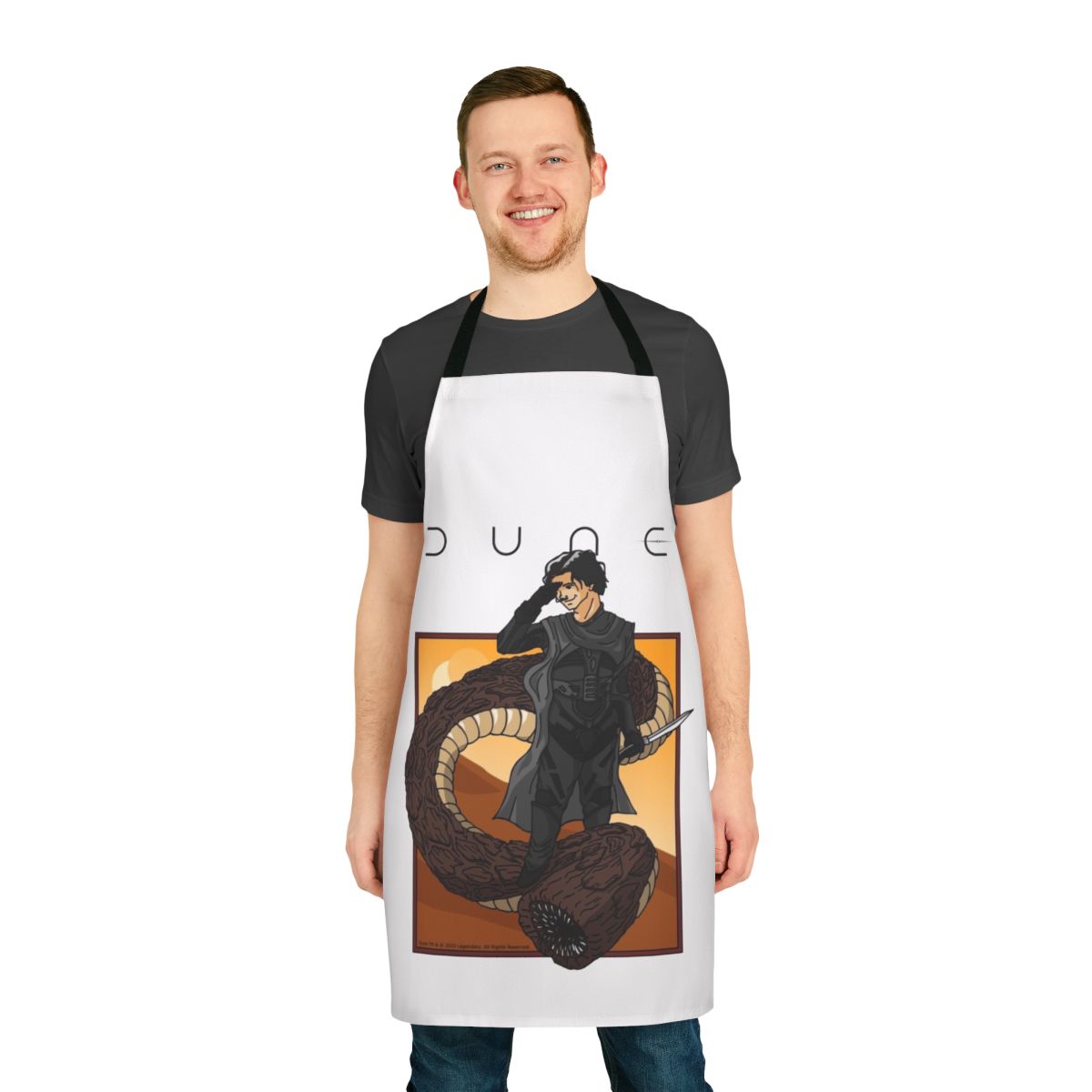 A stylized apron depicting a person riding a giant sandworm, inspired by the Dune sci-fi franchise