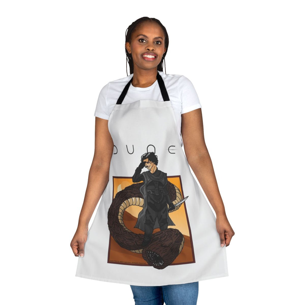A stylized apron depicting a person riding a giant sandworm, inspired by the Dune sci-fi franchise