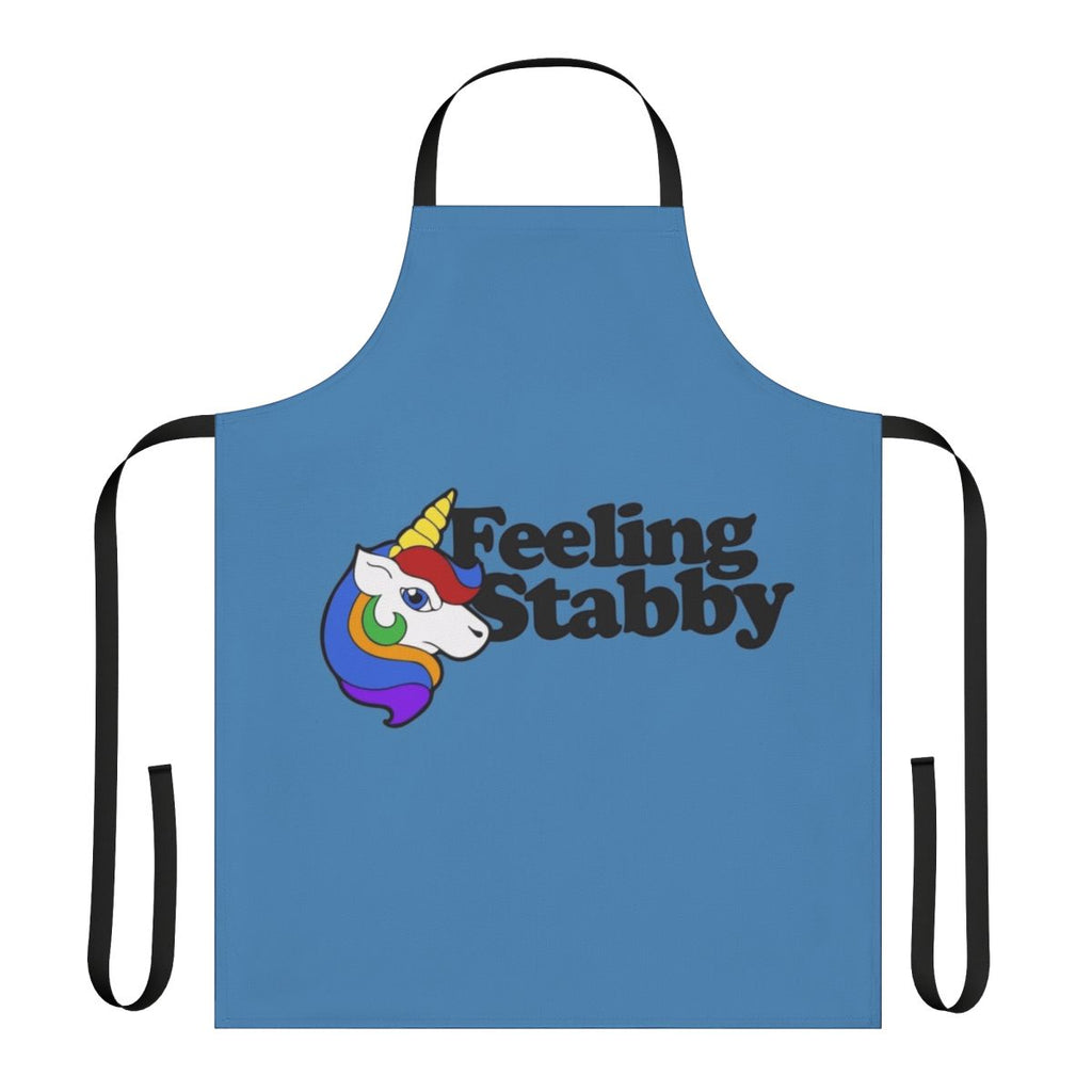 A white apron with a "Feeling Stabby" unicorn design, a humorous and quirky kitchen accessory.