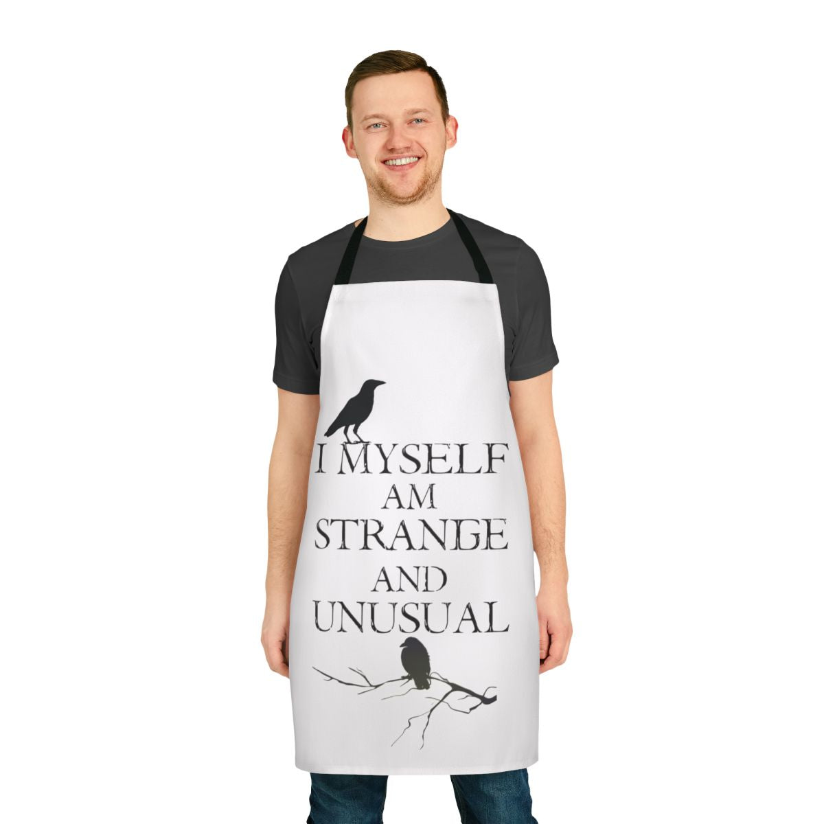 A black and white apron featuring the quote "I Myself Am Strange and Unusual" from the classic Tim Burton film Beetlejuice.