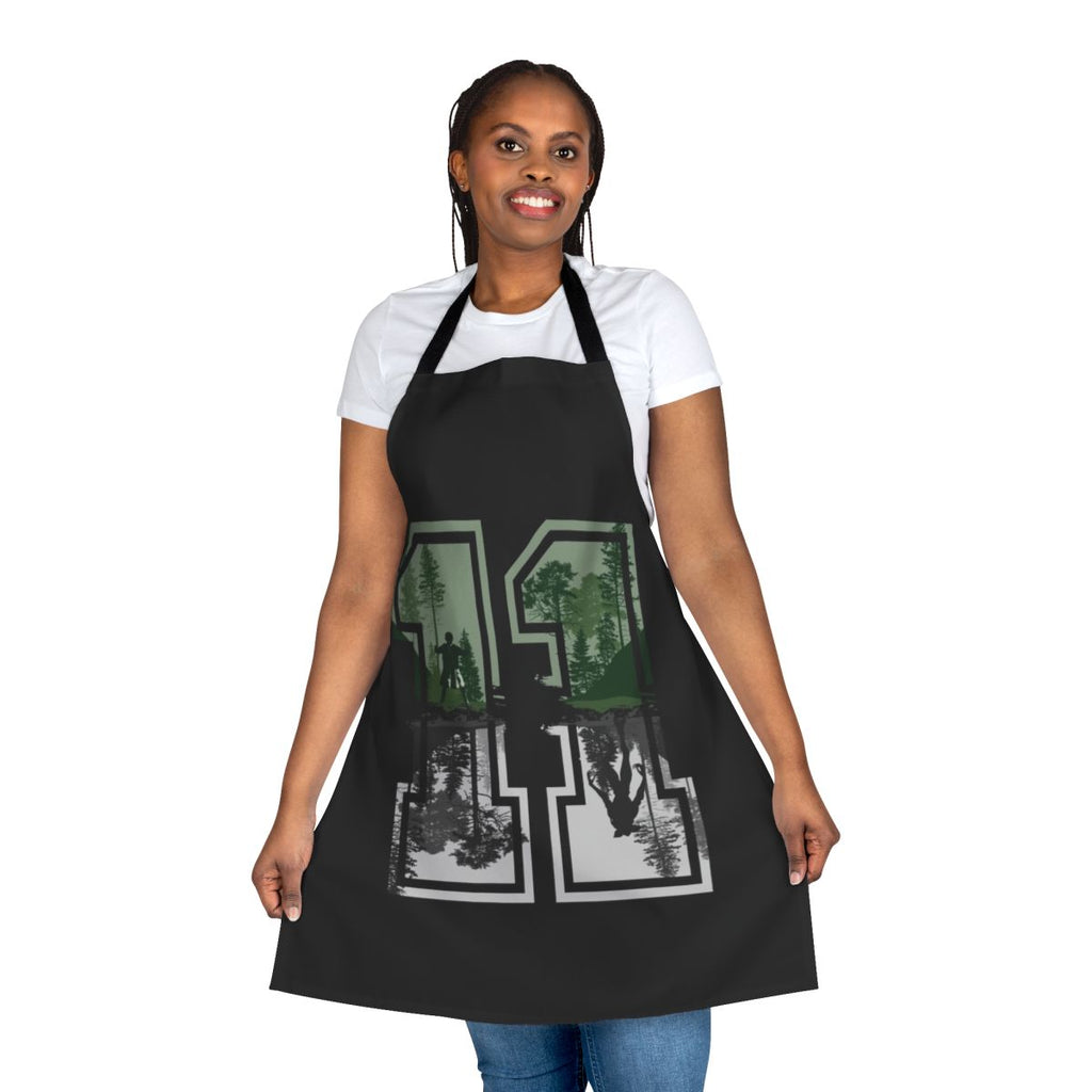 Eleven from Stranger Things wearing a retro-style apron with the series logo