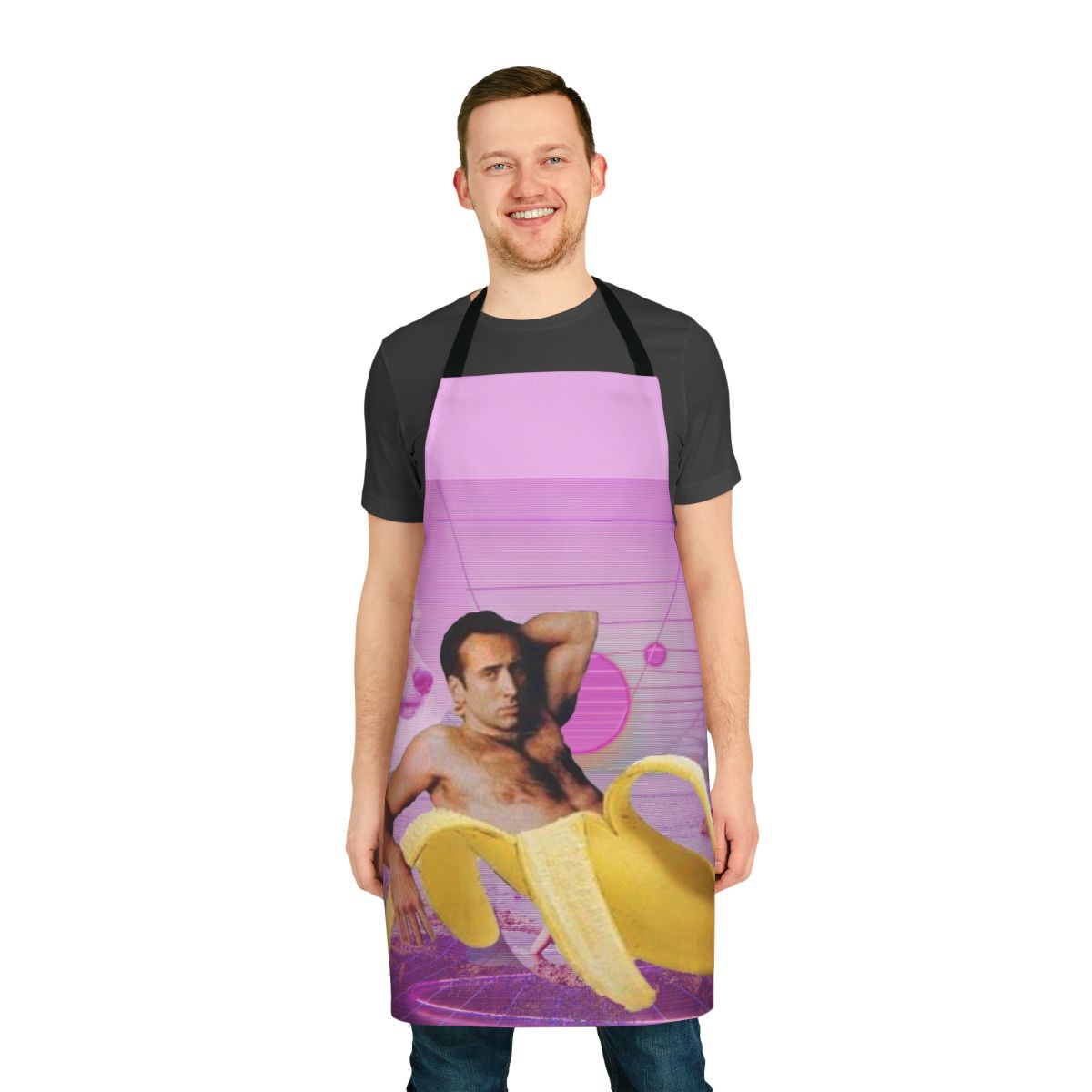 A vibrant and whimsical apron featuring a playful design of Nicholas Cage's face and bananas against a vaporwave-inspired background.