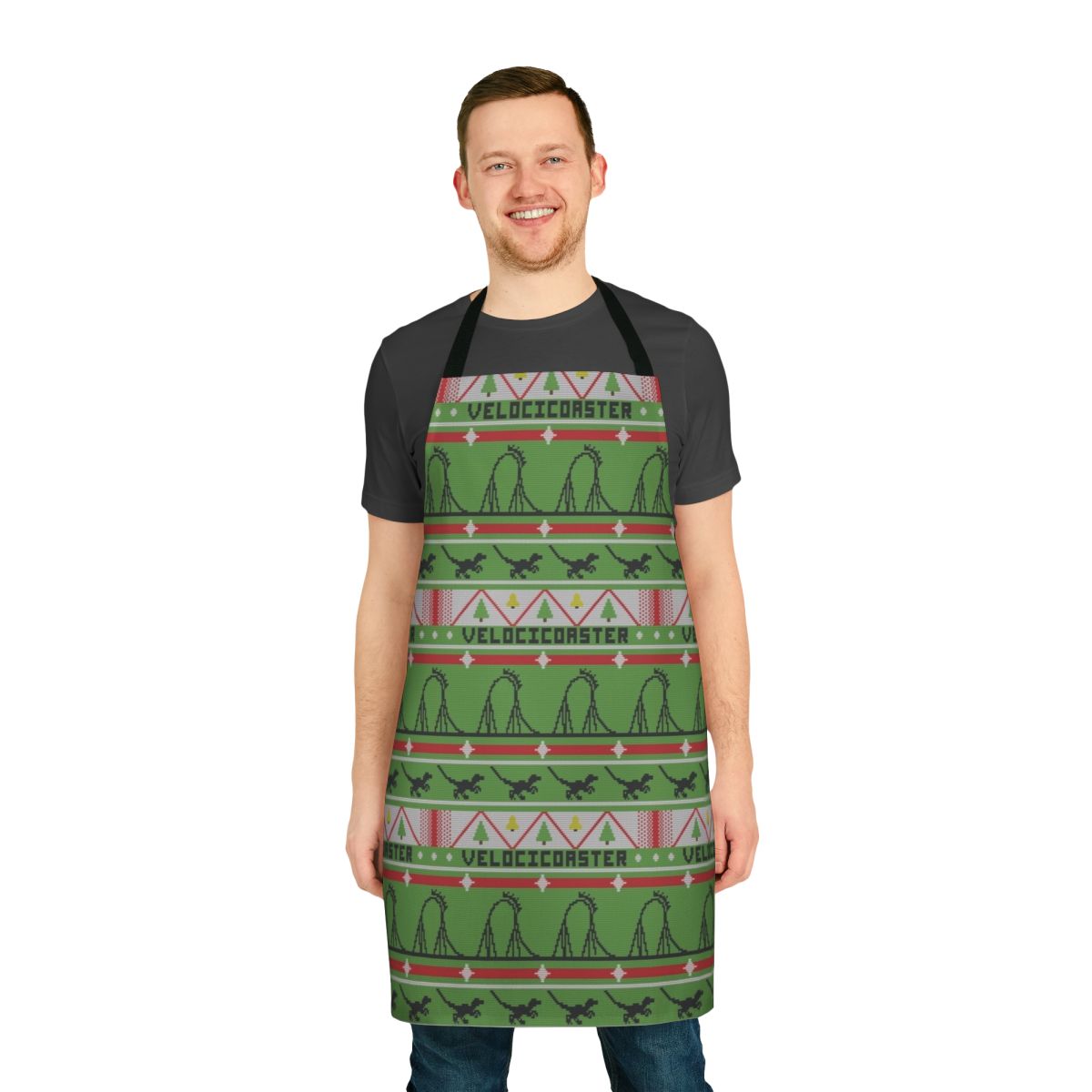 A festive apron featuring a dinosaur theme park-inspired ugly Christmas sweater design