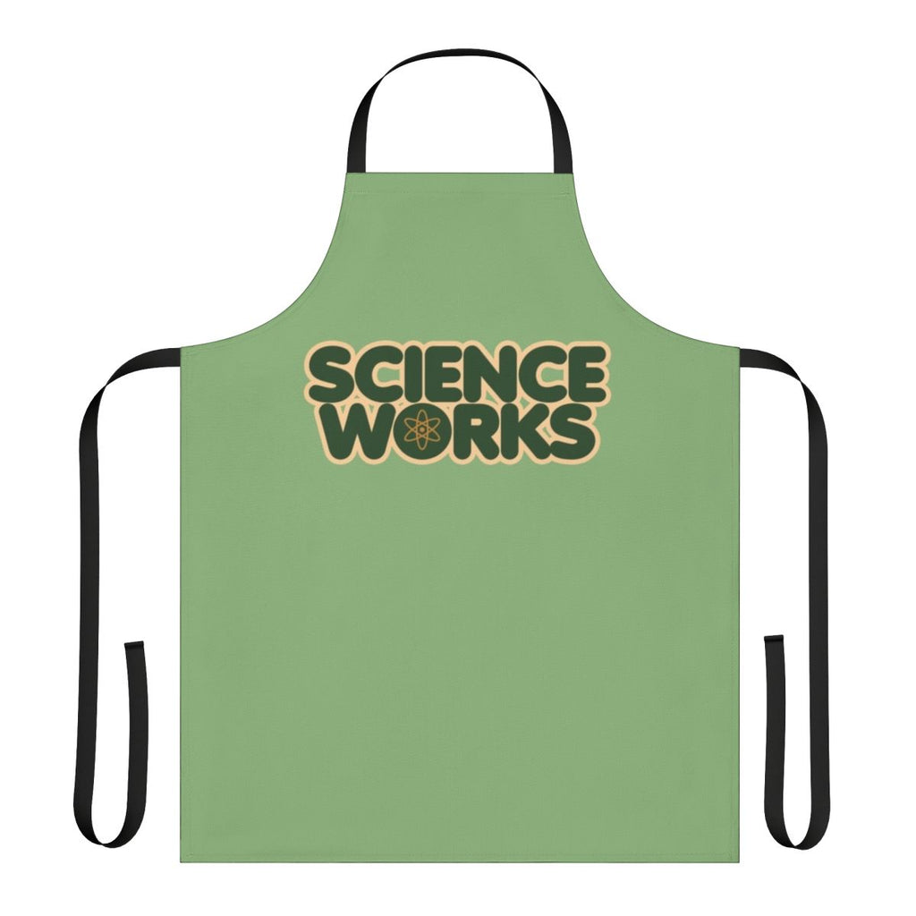Person wearing a white science-themed apron with various scientific icons and designs