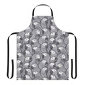 An apron featuring a vibrant pattern of african grey parrots in their natural habitat.