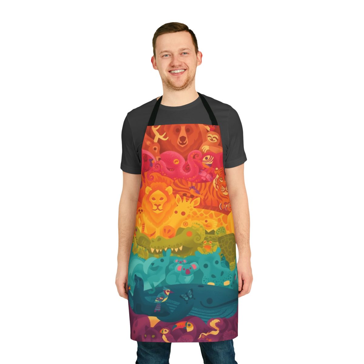 A colorful apron featuring a whimsical print of various animals in a rainbow spectrum design.