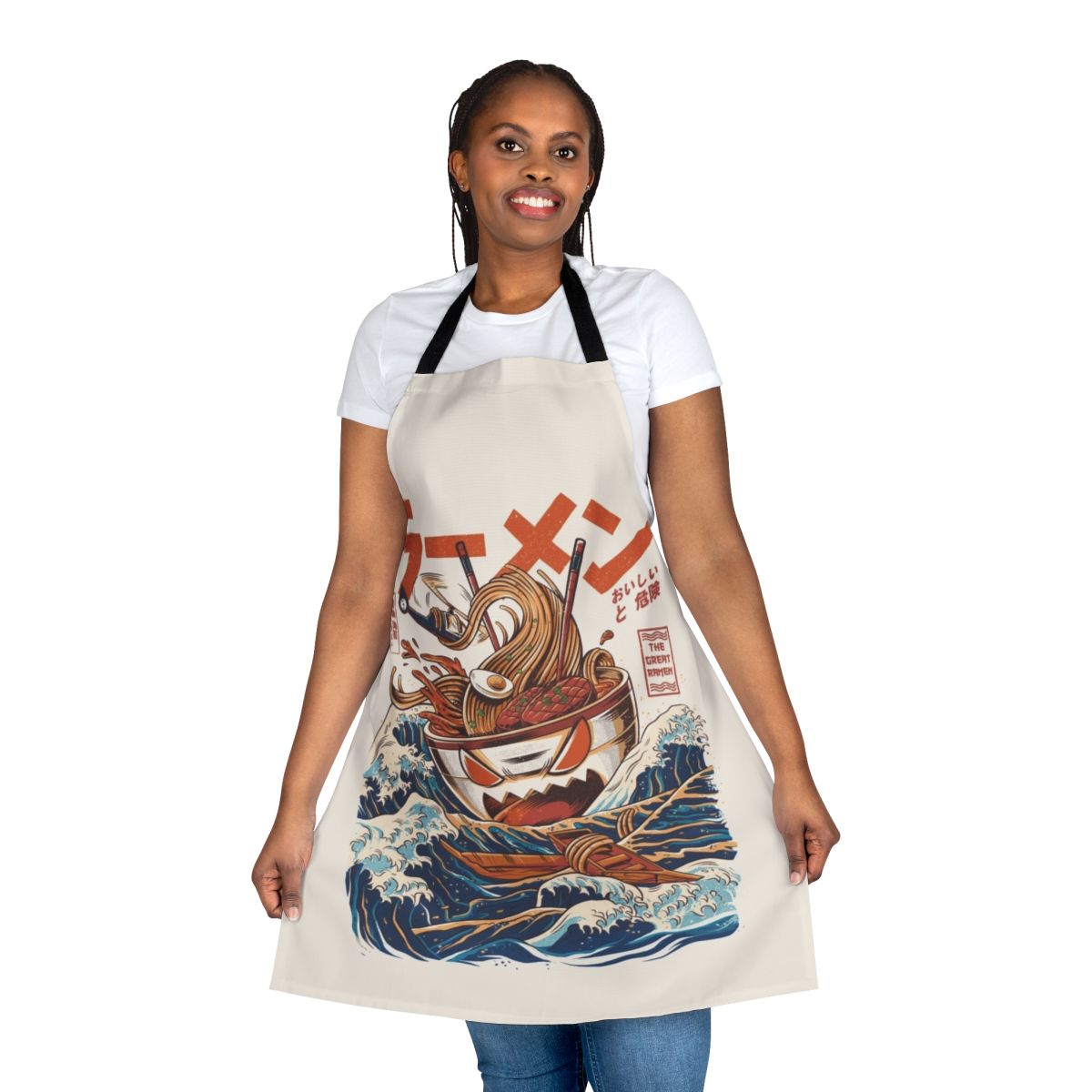 A colorful apron featuring a retro Japanese-style wave and kaiju monster design, perfect for cooking ramen and other Japanese dishes.
