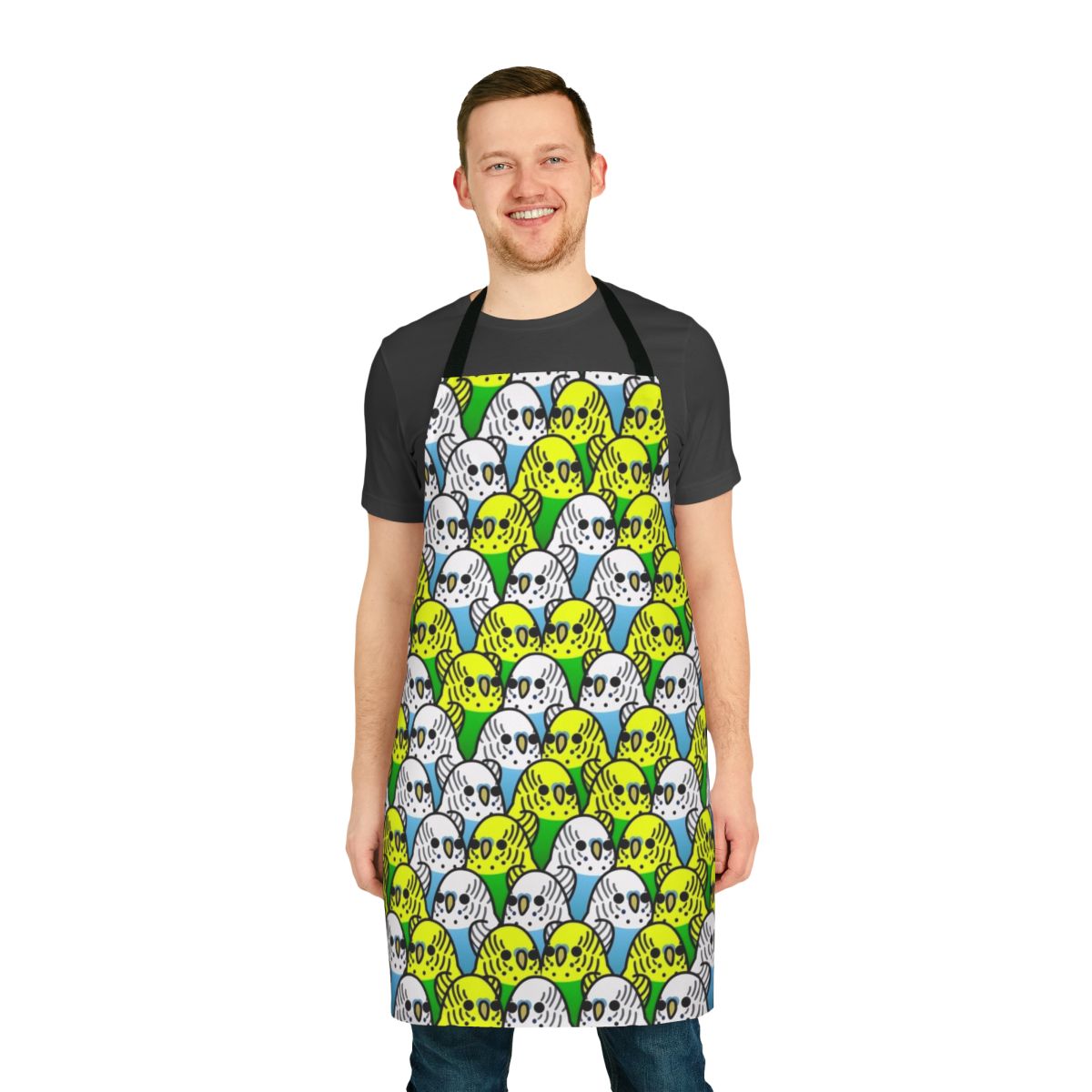 Colorful apron featuring a playful design of various species of birds including budgies, cockatiels, and macaws.