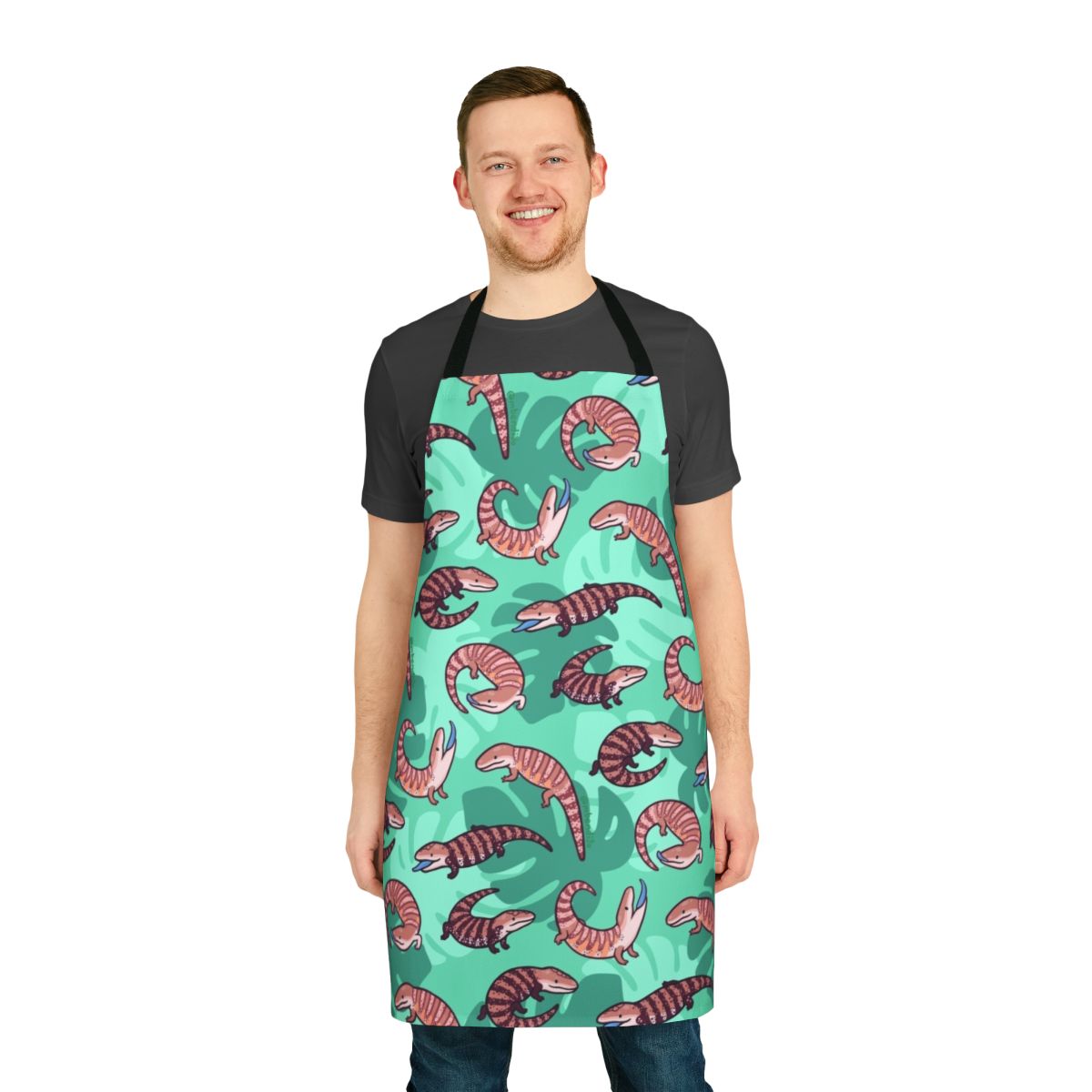 A stylish and durable apron featuring a delightful blue tongue skink design with vibrant repeating patterns.