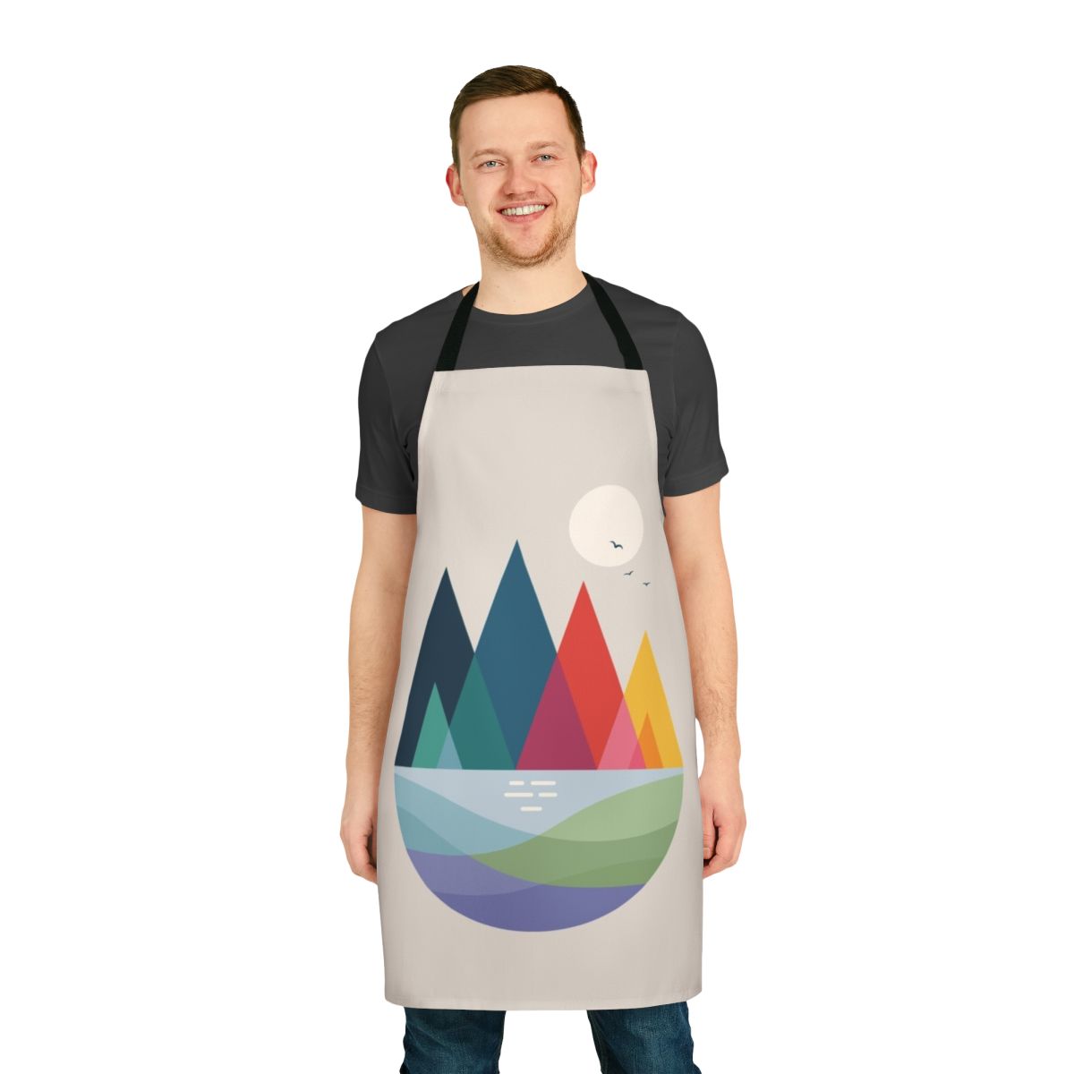 A vibrant, colorful abstract design apron featuring a landscape with a rainbow, birds, and geometric shapes.