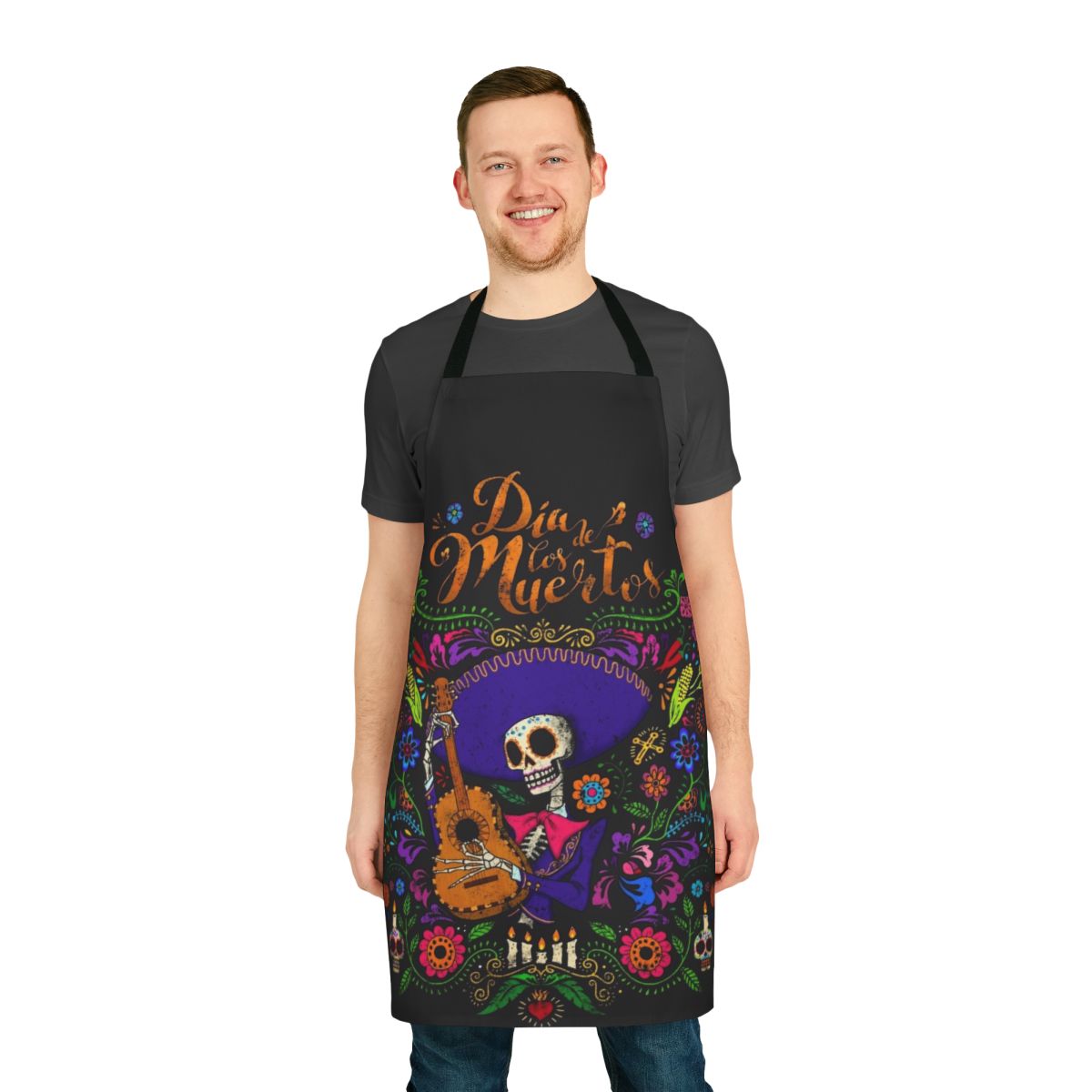 Colorful apron with day of the dead or dia de los muertos inspired design featuring sugar skulls, flowers, and traditional Mexican imagery.