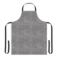 Colorful elephant-print apron hanging on a hook