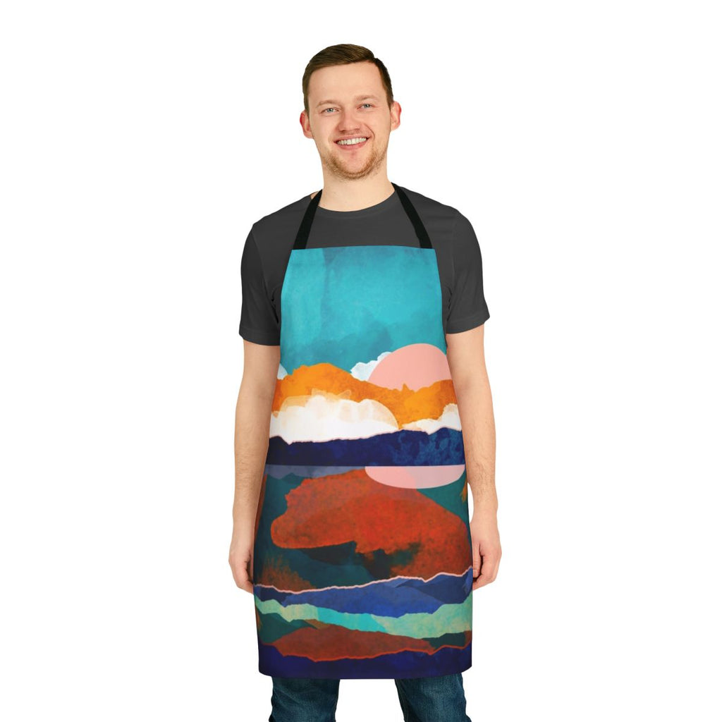 Fallscape Apron featuring a watercolor painting of a scenic autumn landscape with mountains, water reflection, and colorful foliage.