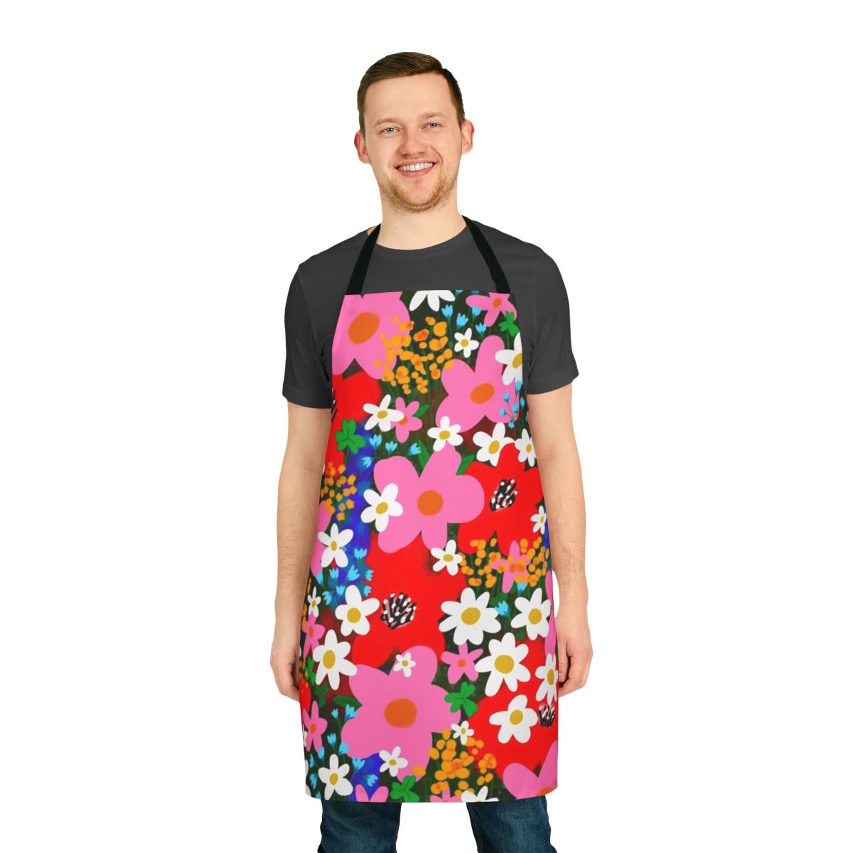 A vibrant, floral-patterned apron featuring daisies, poppies, and other blooms in a retro, 1960s-inspired design.