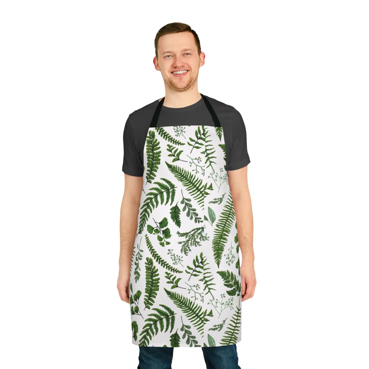 A beautiful green apron featuring a lush pattern of ferns and leaves, perfect for nature and garden lovers.