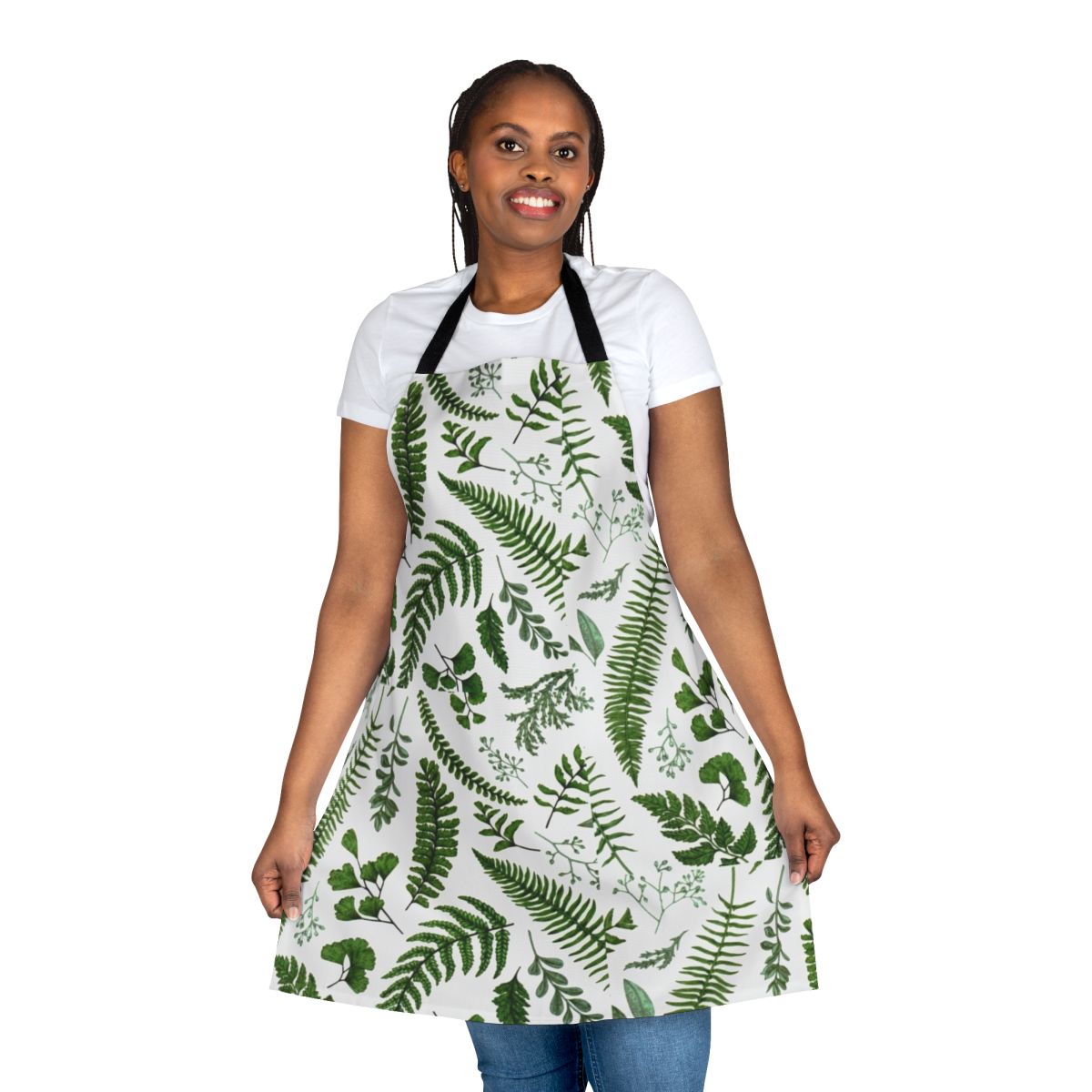 A beautiful green apron featuring a lush pattern of ferns and leaves, perfect for nature and garden lovers.