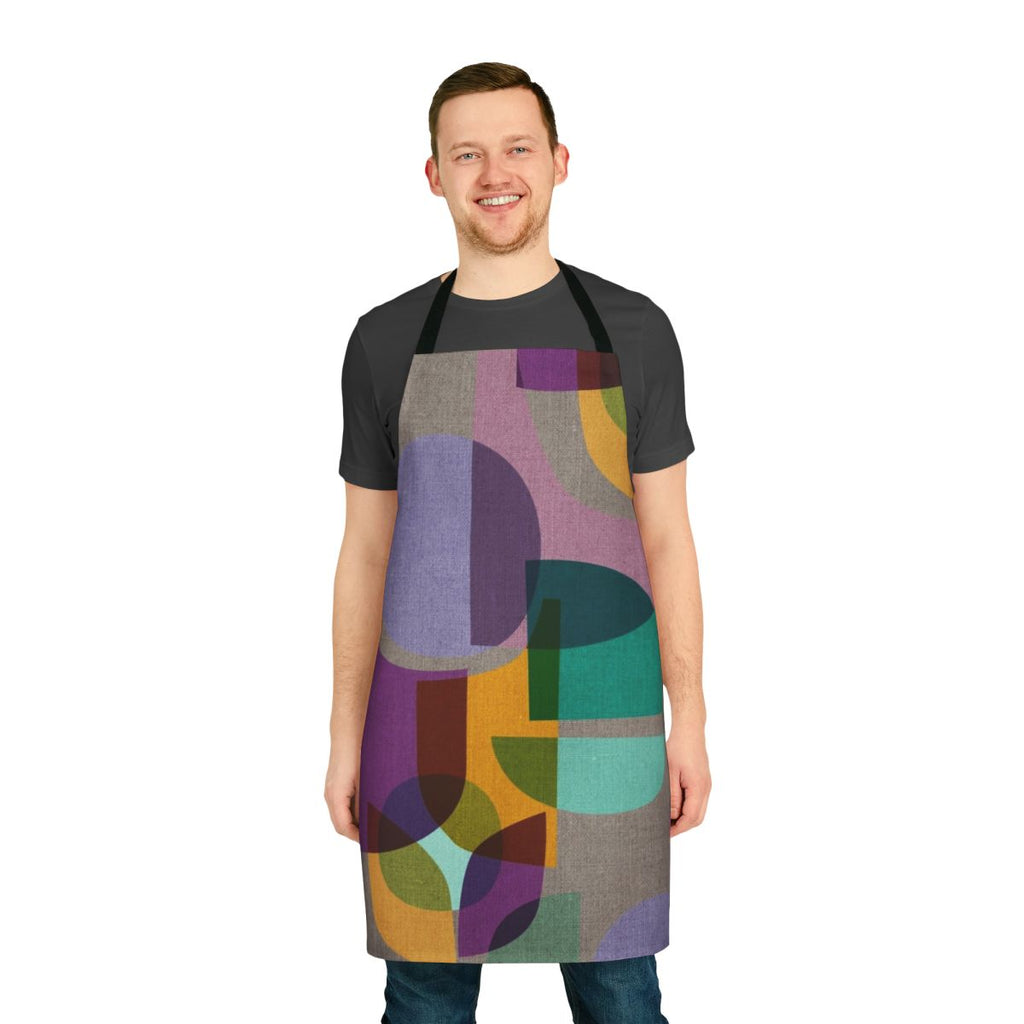 Colorful mid-century inspired apron with a kaleidoscope print design in shades of purple, lavender, and aqua.