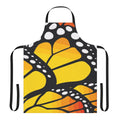 Vibrant monarch butterfly design on an orange apron with abstract and floral elements.
