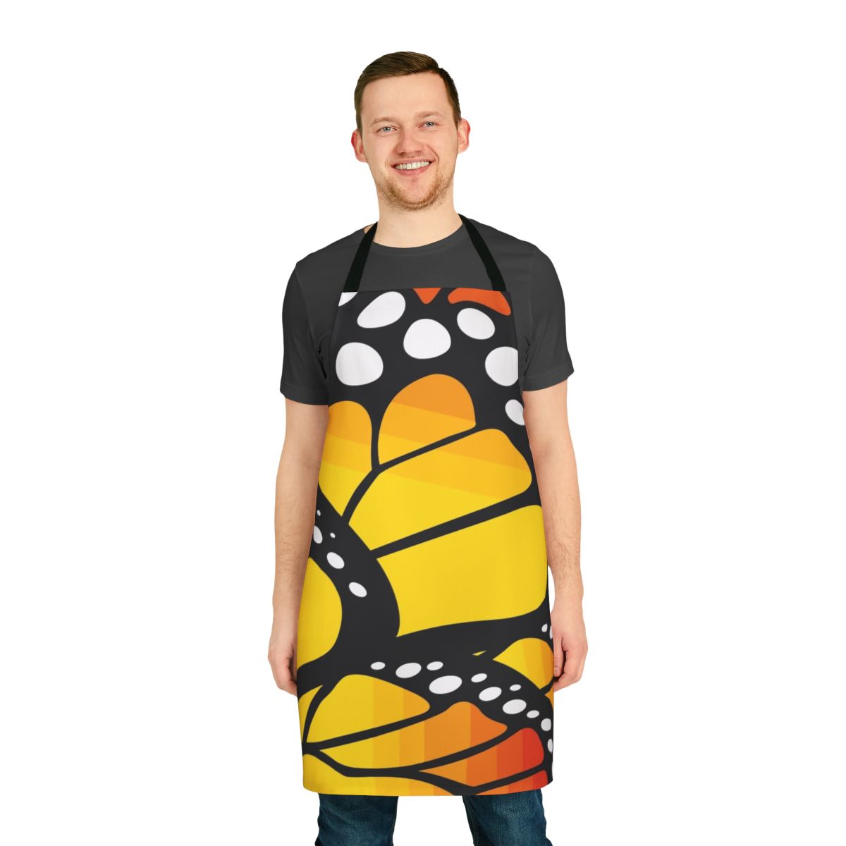 Vibrant monarch butterfly design on an orange apron with abstract and floral elements.