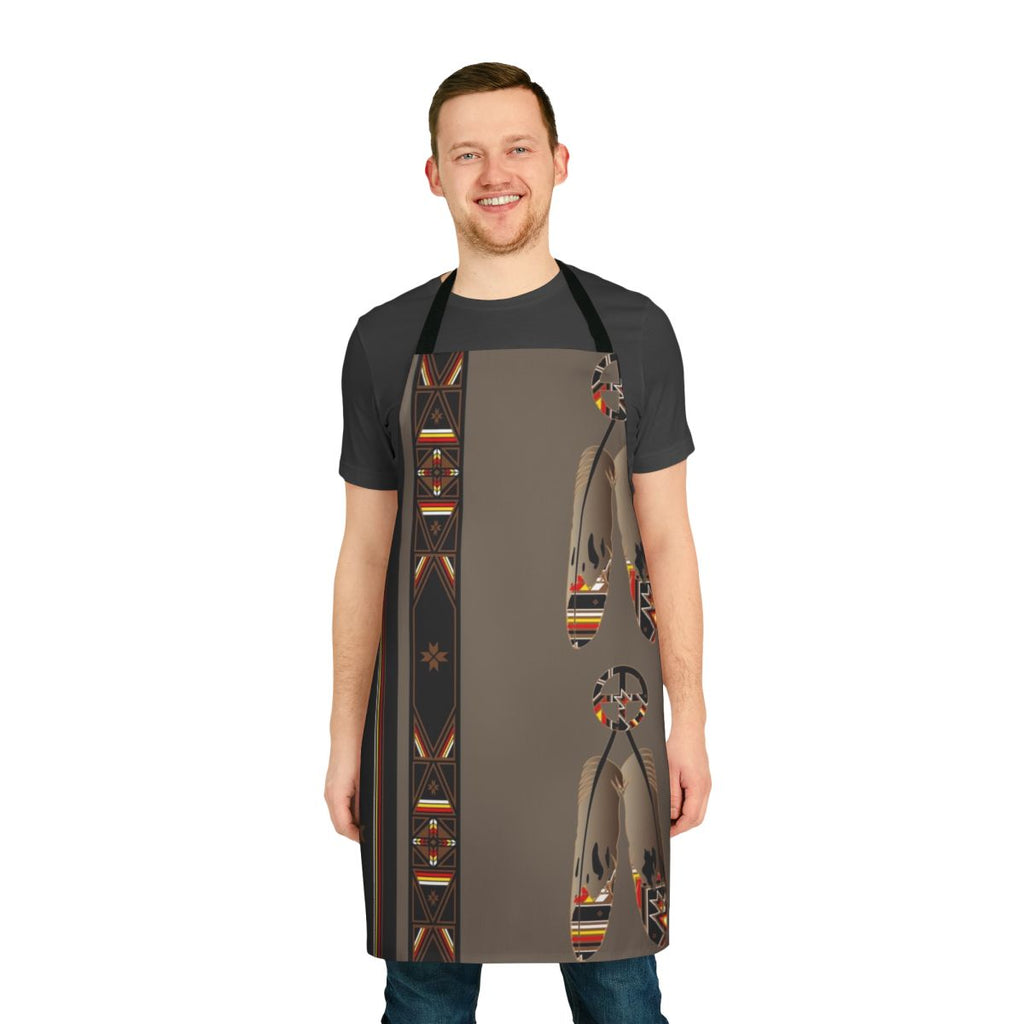 Colorful apron featuring a Melvin War Eagle-style pop art design with feathers, an eagle, and cultural symbols