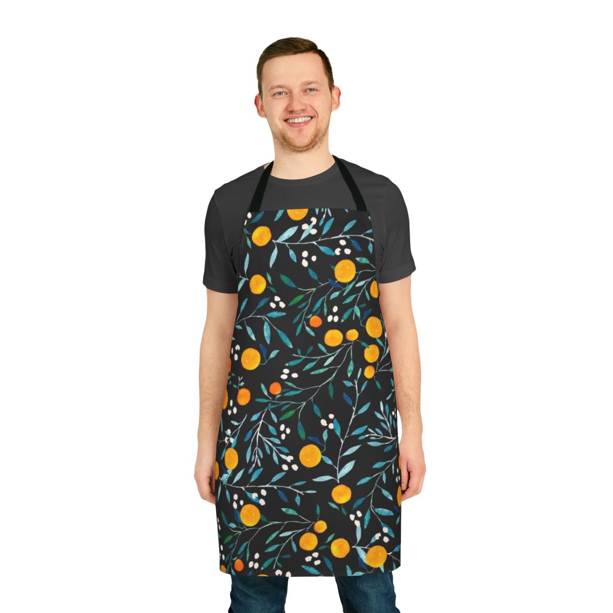 Watercolor illustration of oranges on a black background, featured on an apron.