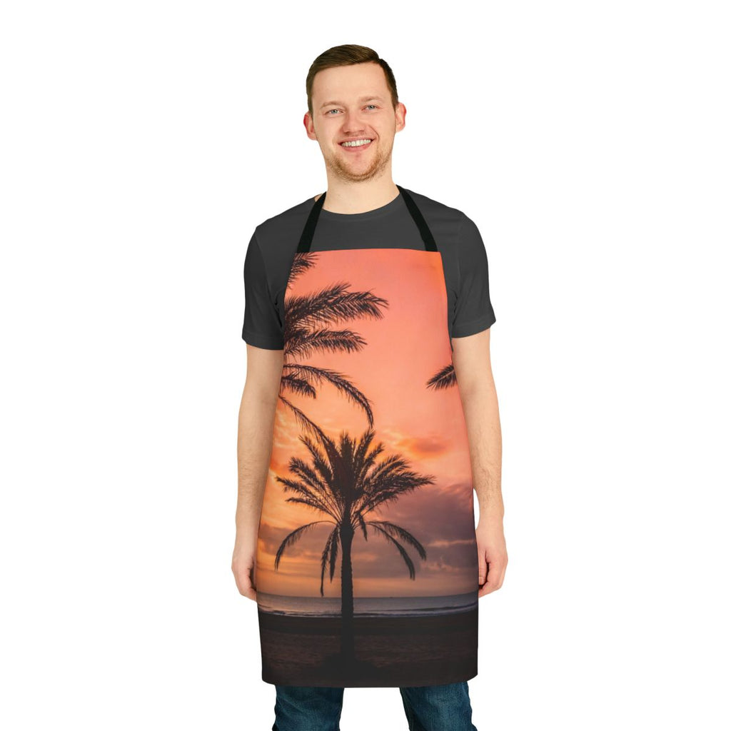 Apron featuring a beautiful sunrise scene with silhouetted palm trees against a colorful sky.