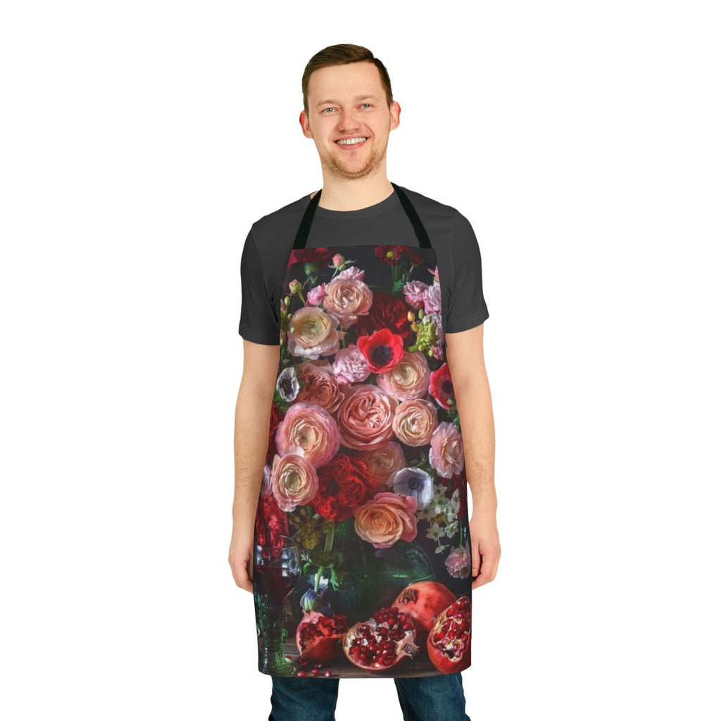 Colorful apron featuring a botanical design with pomegranates, flowers, and leaves.