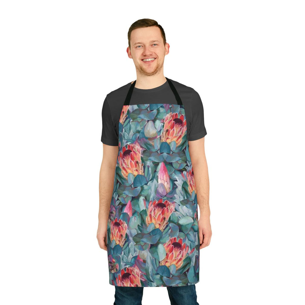 Apron featuring a vibrant, watercolor-style print of protea flowers and tropical foliage