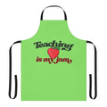 Bright red apple-themed apron with the text "Teaching Is My Jam"