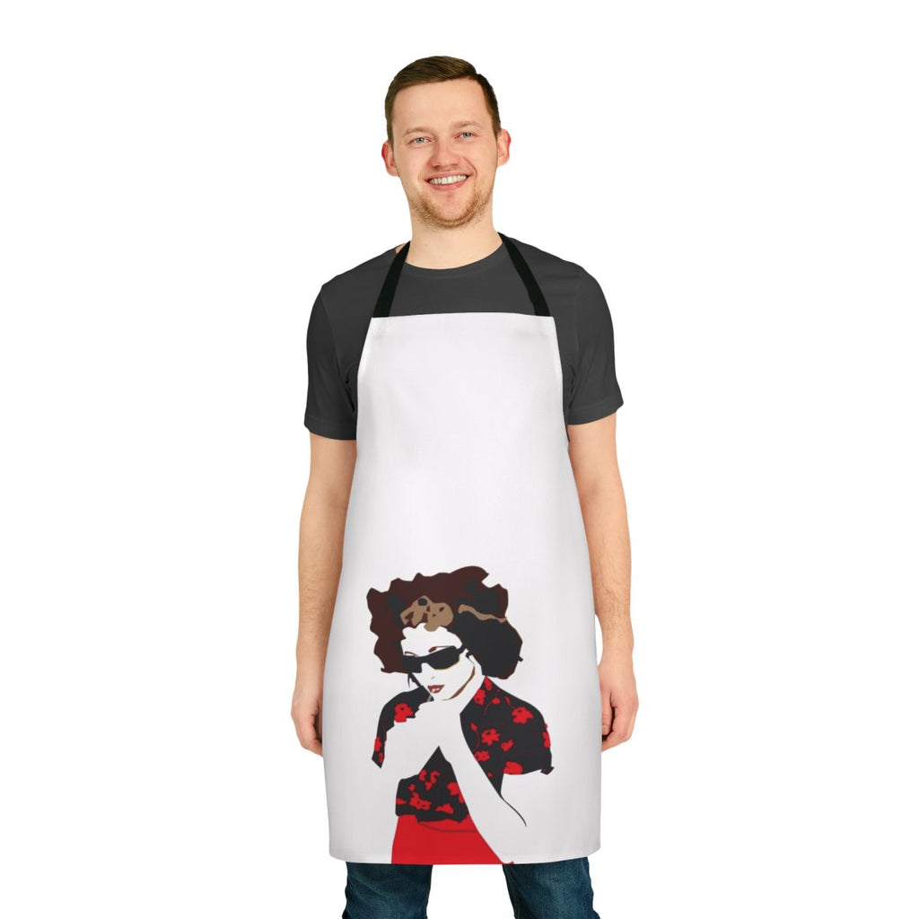 A vibrant red apron featuring a bold flower design, inspired by the music of artist Goldfrapp.
